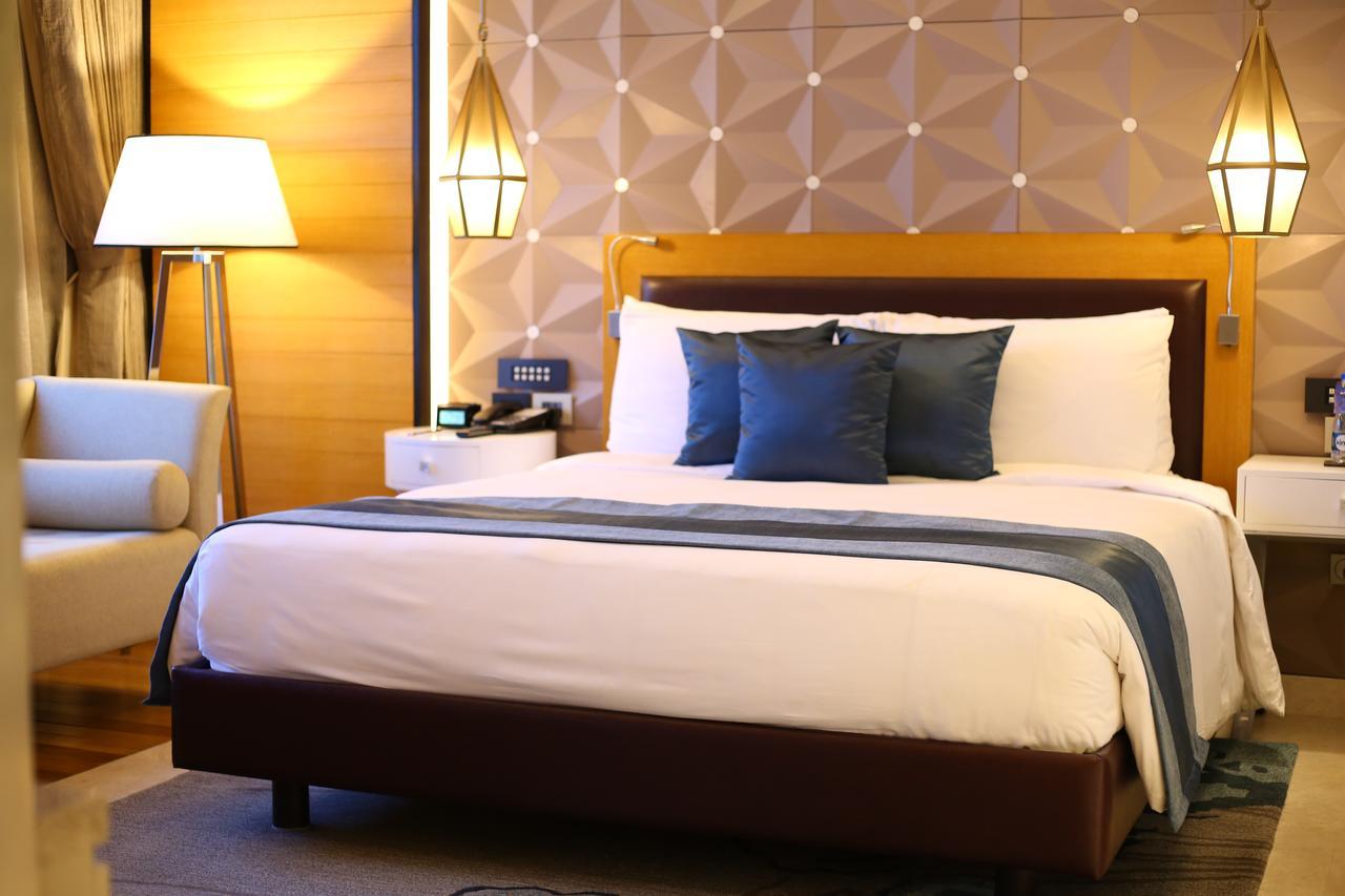 Radisson Blu Κοϊμπατόρε Εξωτερικό φωτογραφία A bed in a hotel room